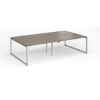 Back-to-back bench desk with wood-effect top and silver metal legs on a white background