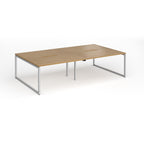 Back-to-back bench desk with wood-effect top and silver metal legs on a white background