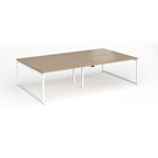 Back-to-back bench desk with wood-effect top and white metal legs on a white background