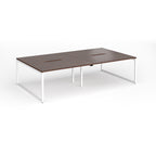 Back-to-back bench desk with wood-effect top and white metal legs on a white background