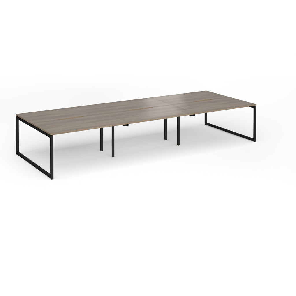 Long back-to-back desk with wood-effect top and black metal legs on a white background