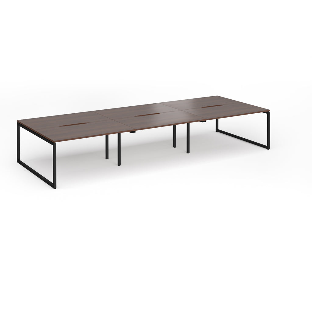Long back-to-back desk with wood-effect top and black metal legs on a white background