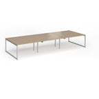 Long back-to-back desk with wood-effect top and silver metal legs on a white background