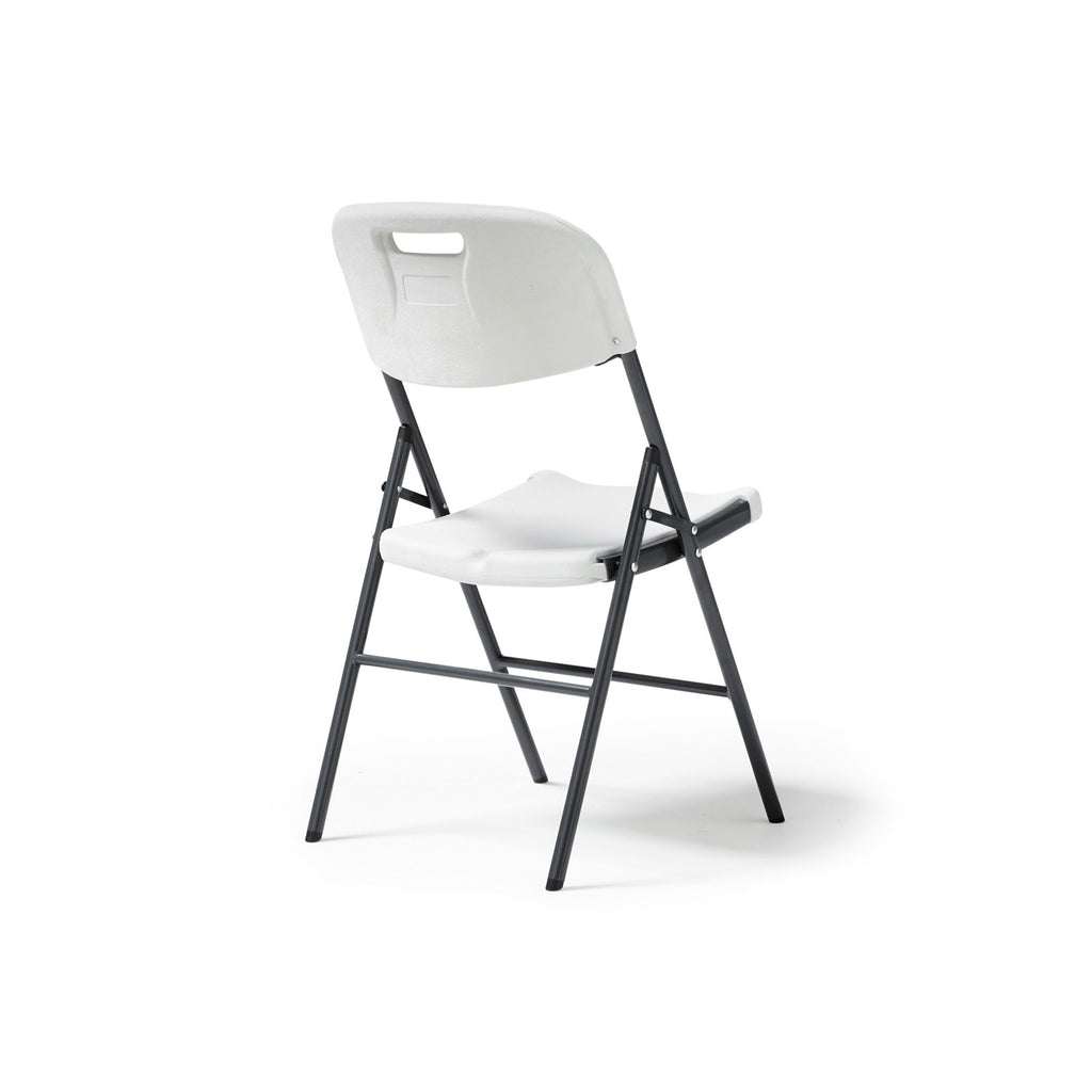 White folding chair with black legs on a white background