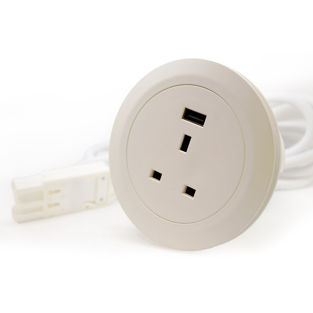 Round beige electrical outlet with one socket and one USB on a white background