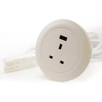 Round beige electrical outlet with one socket and one USB on a white background
