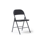 A black folding chair with a curved backrest and seat, shown from a three-quarter angle on a clean white background.