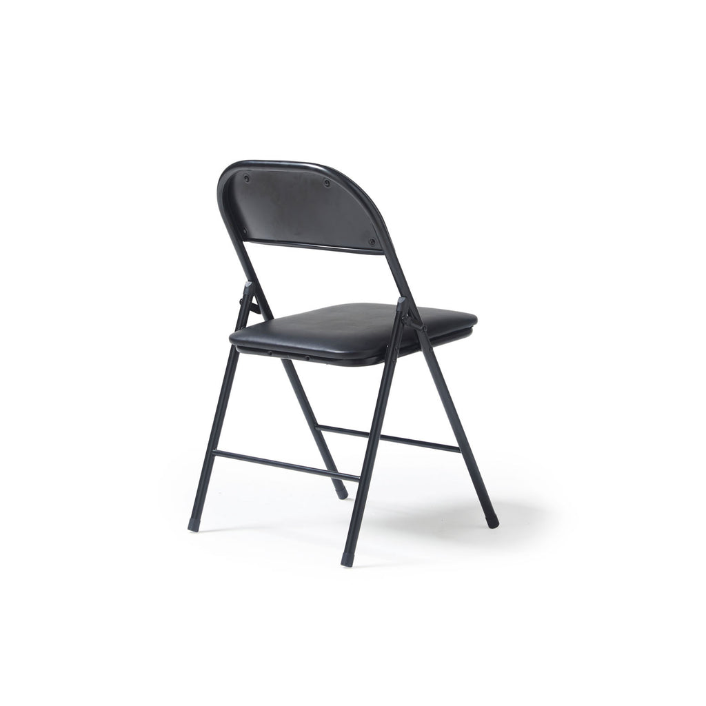 A black folding chair with a padded seat and backrest, shown from a three-quarter angle on a clean white background.