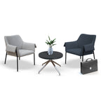 Two armchairs and a table on a white background