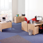 Modern office setup with wooden desks, chairs, and office equipment.