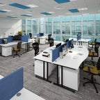 Modern office space with desks, chairs, and large windows.