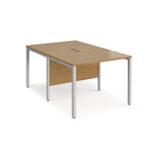 Back-to-back office desk with wood-effect top and silver metal frame on a white background