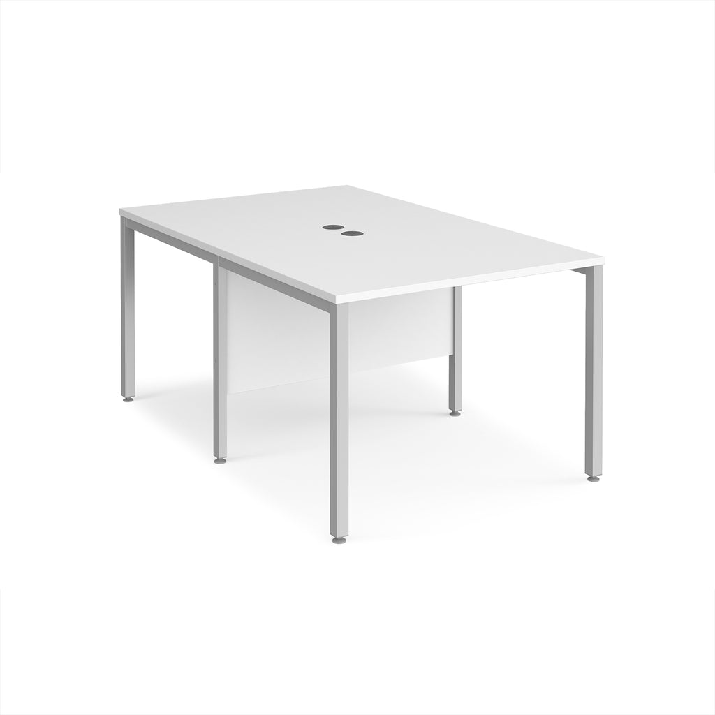 Back-to-back office desk with white top and silver metal frame on a white background