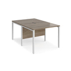 Back-to-back office desk with wood-effect top and white metal frame on a white background