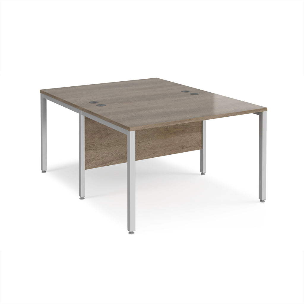 Back-to-back office desk with wood-effect top and silver metal frame on a white background