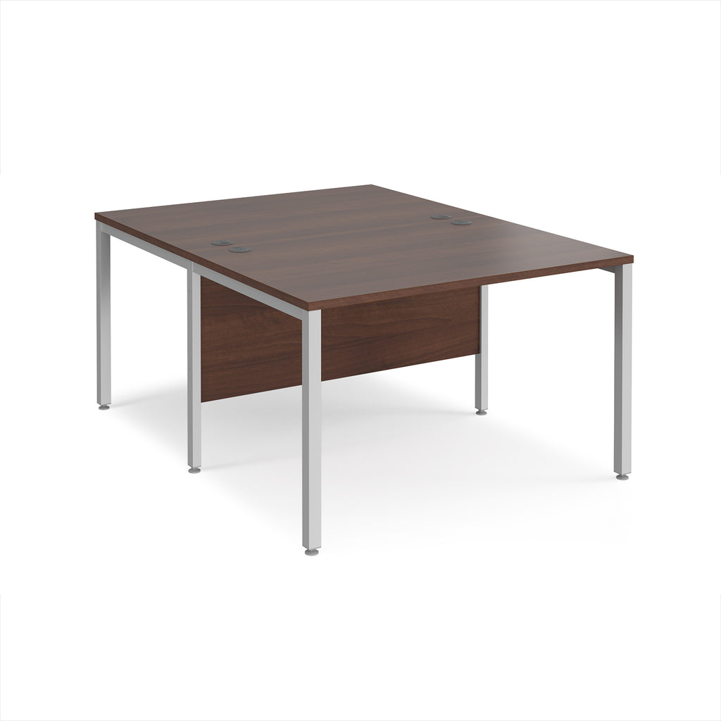 Back-to-back office desk with wood-effect top and silver metal frame on a white background