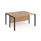 Back-to-back desk with wood-effect top and black metal frame on a white background