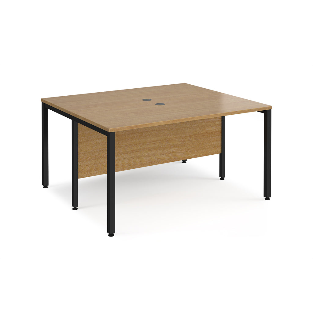 Back-to-back desk with wood-effect top and black metal frame on a white background