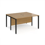 Back-to-back desk with wood-effect top and black metal frame on a white background