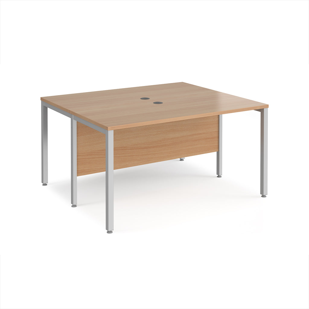 Back-to-back desk with wood-effect top and silver metal frame on a white background