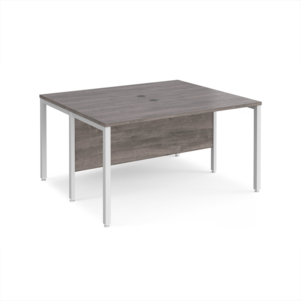 Back-to-back desk with grey wood-effect top and white metal frame on a white background