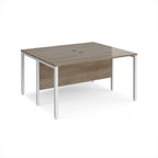 Back-to-back desk with wood-effect top and white metal frame on a white background