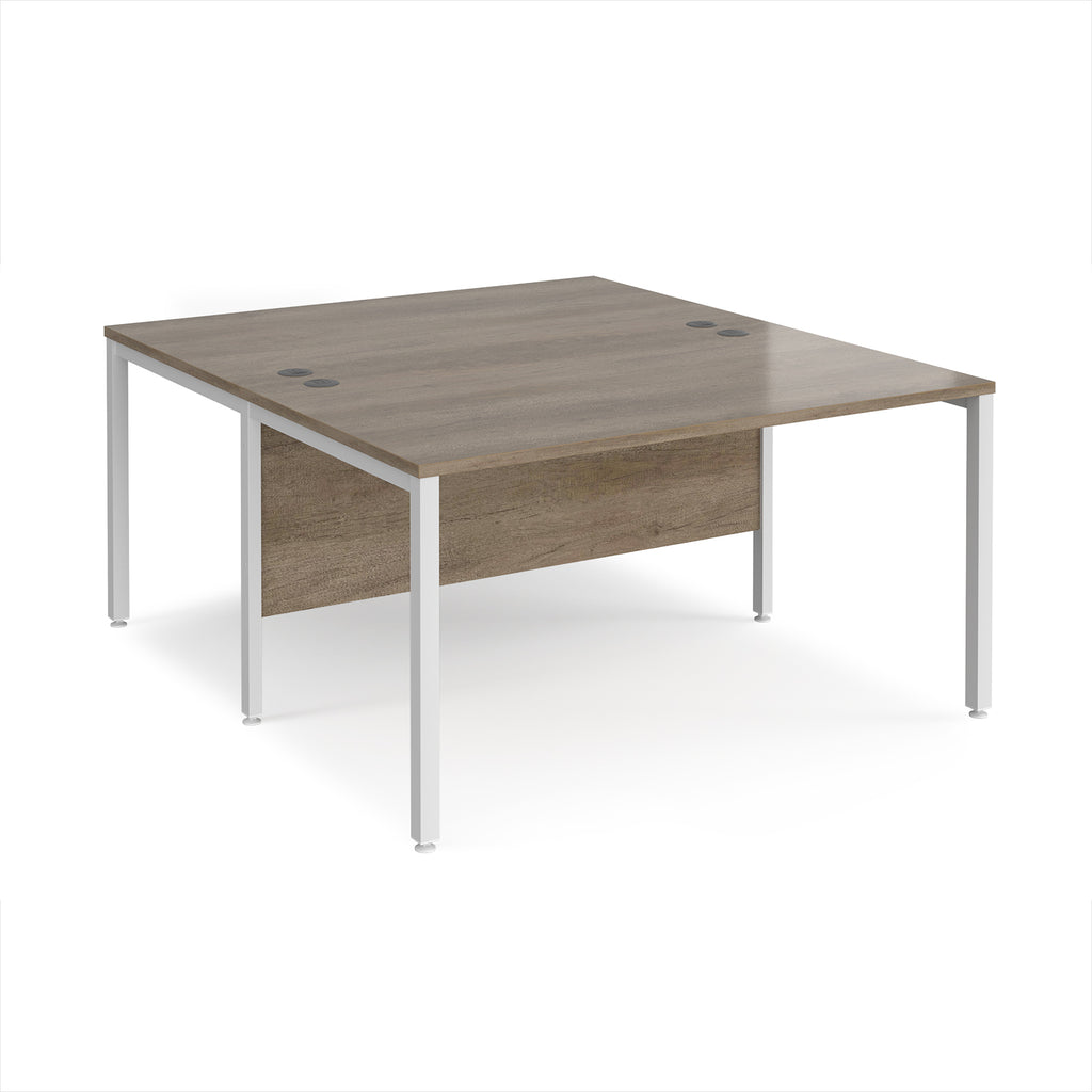 Back-to-back office desk with wood-effect top and white metal frame on a white background