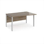 Office desk with wave wood-effect top and silver metal legs on a white background
