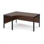 Ergonomic office desk with wood-effect top and black metal frame on a white background
