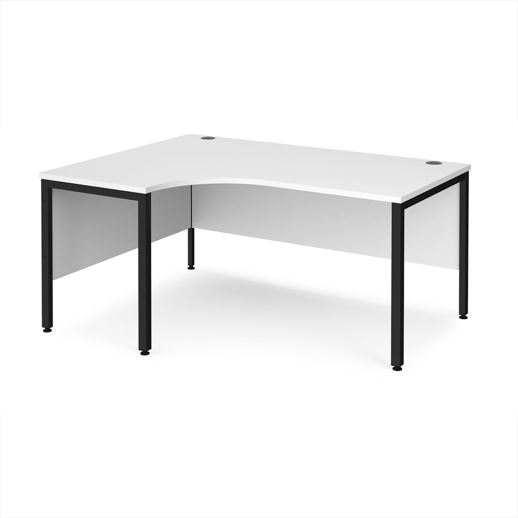 Ergonomic office desk with white top and black metal frame on a white background