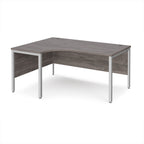 Ergonomic office desk with grey wood-effect top and silver metal frame on a white background