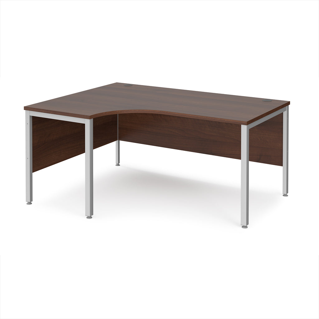 Ergonomic office desk with wood-effect top and silver metal frame on a white background
