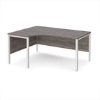 Ergonomic office desk with grey wood-effect top and white metal frame on a white background