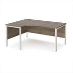Ergonomic office desk with wood-effect top and white metal frame on a white background