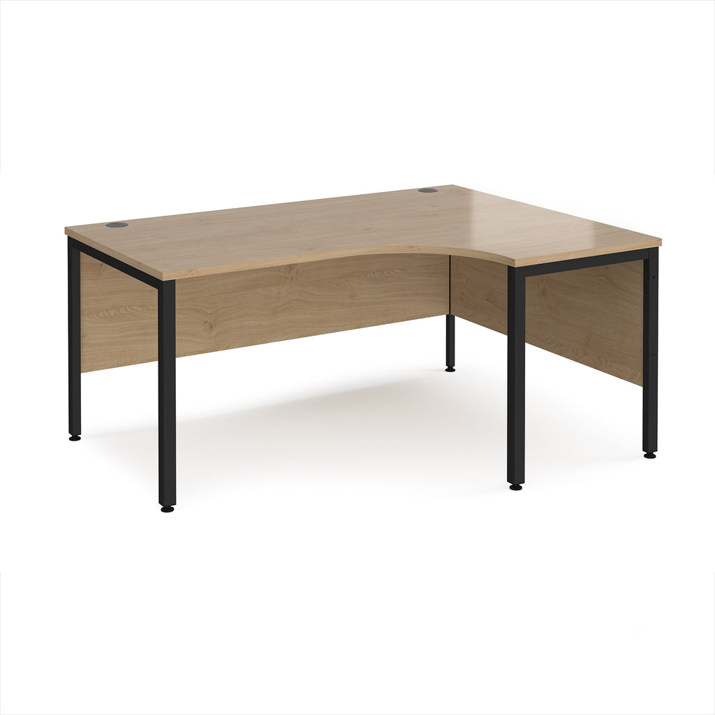 Ergonomic office desk with wood-effect top and black metal frame on a white background