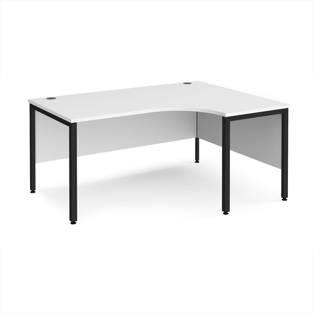 Ergonomic office desk with white top and black metal frame on a white background