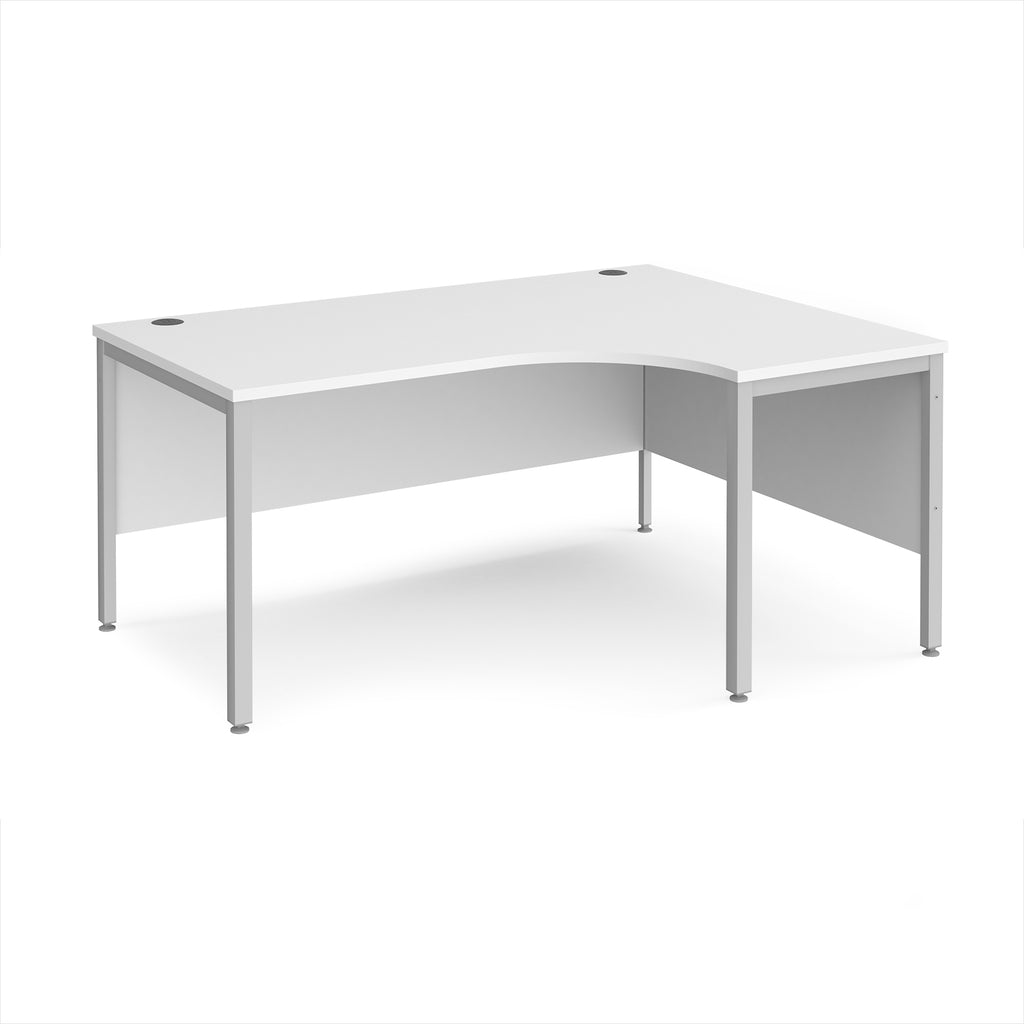 Ergonomic office desk with white top and silver metal frame on a white background