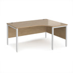Ergonomic office desk with wood-effect top and white metal frame on a white background