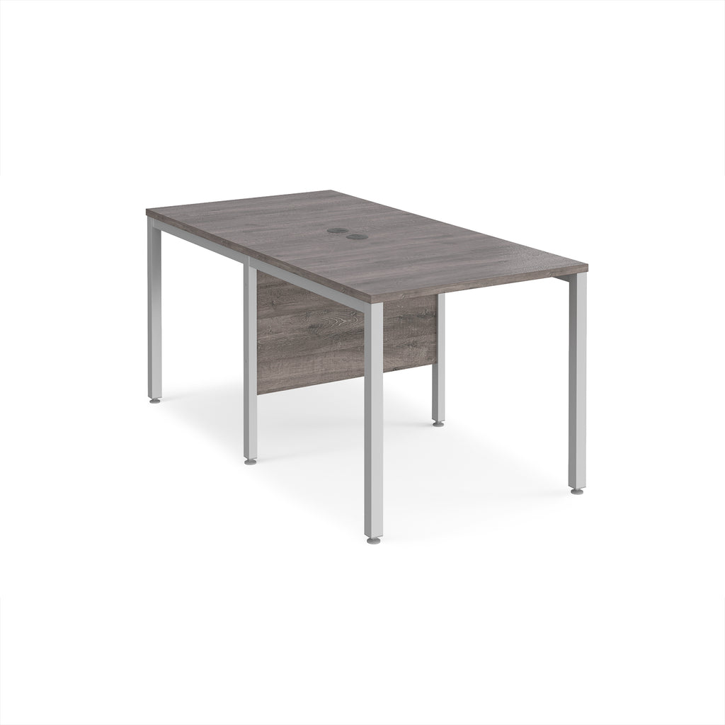 Back-to-back office desk with grey wood-effect top and silver metal frame on a white background