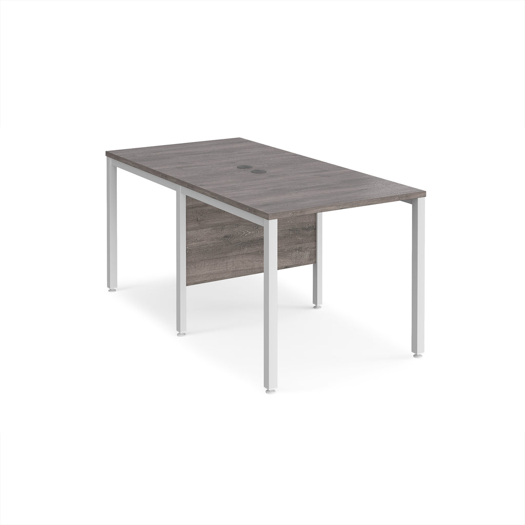 Back-to-back office desk with grey wood-effect top and white metal frame on a white background