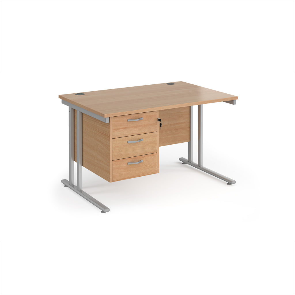 Wooden office desk with silver metal legs and fixed pedestal on a white background