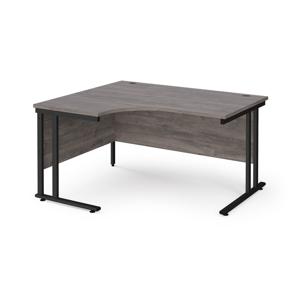 Corner office desk with wooden surface and black metal legs on a white background