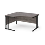 Corner office desk with wooden surface and black metal legs on a white background