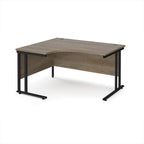 Corner desk with wooden top and black metal legs on a white background