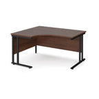 Wooden corner desk with black metal legs on a white background