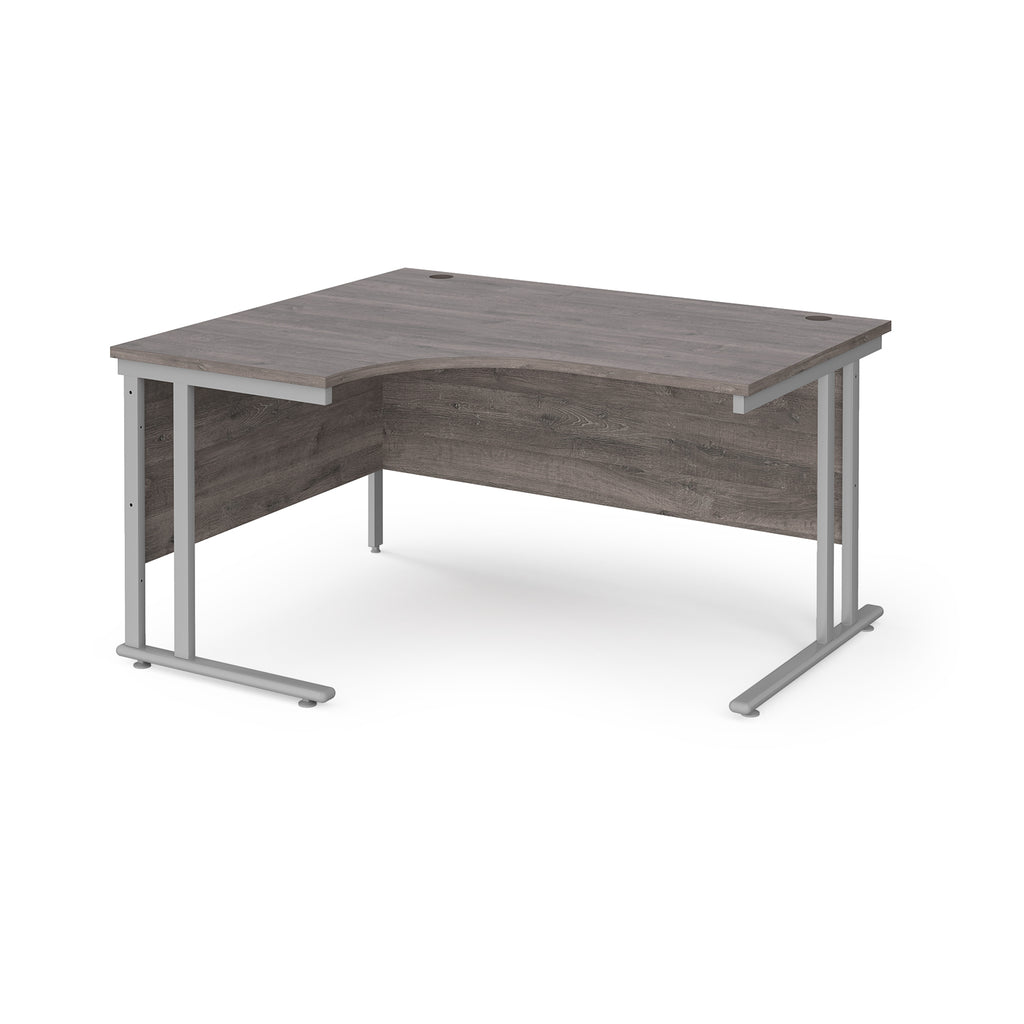 Corner office desk with wooden top and silver metal legs on a white background