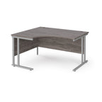 Corner office desk with wooden top and silver metal legs on a white background