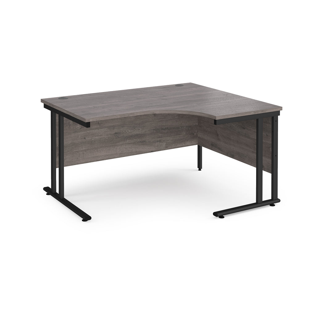 Corner office desk with wooden top and black metal legs on a white background