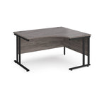 Corner office desk with wooden top and black metal legs on a white background