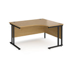 Wooden corner desk with black metal legs on a white background